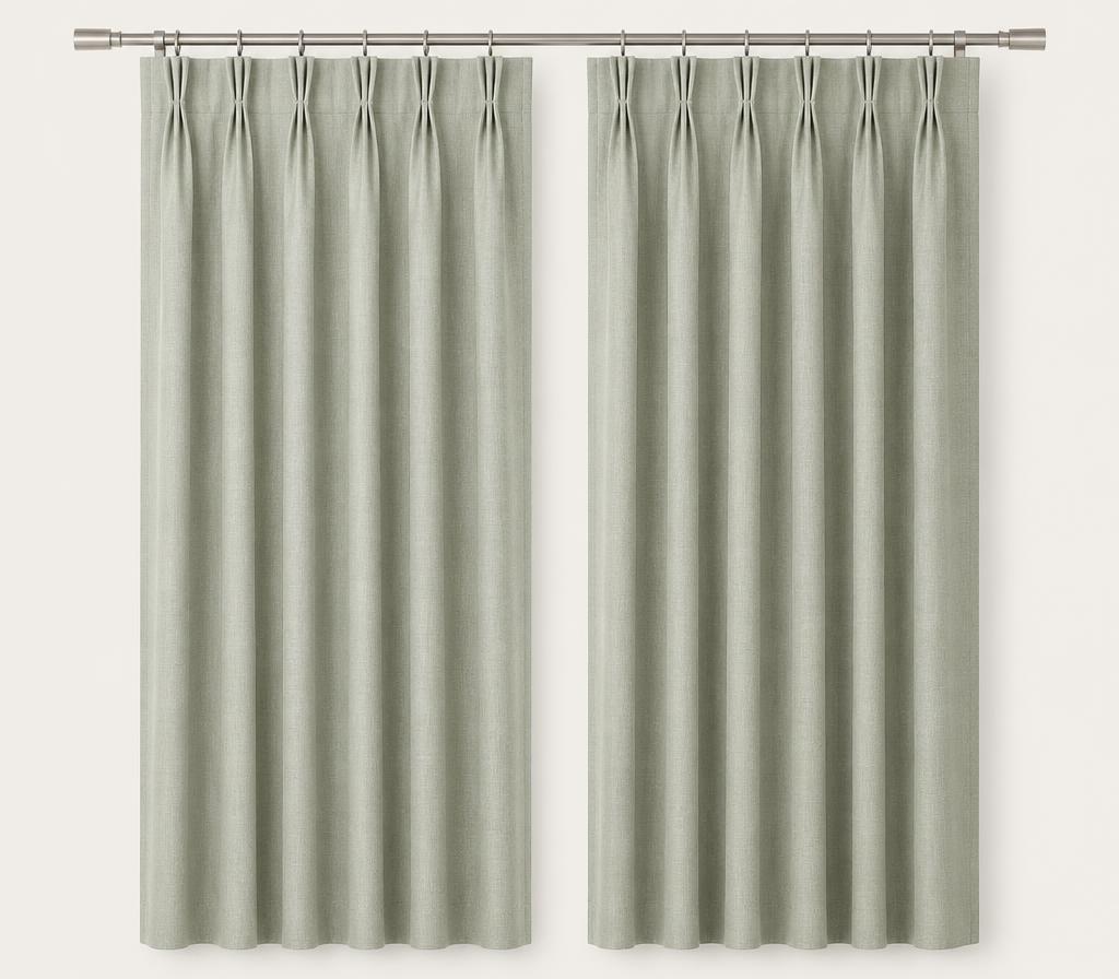 Pale linen curtains with a formal triple pinch pleat heading